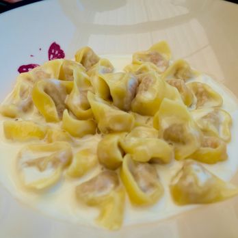 Gucci Osteria da Massimo Bottura signature dishes Risotto Camouflaged as PizzaSeafood SaladTortellini with Parmigiano Reggiano Cream